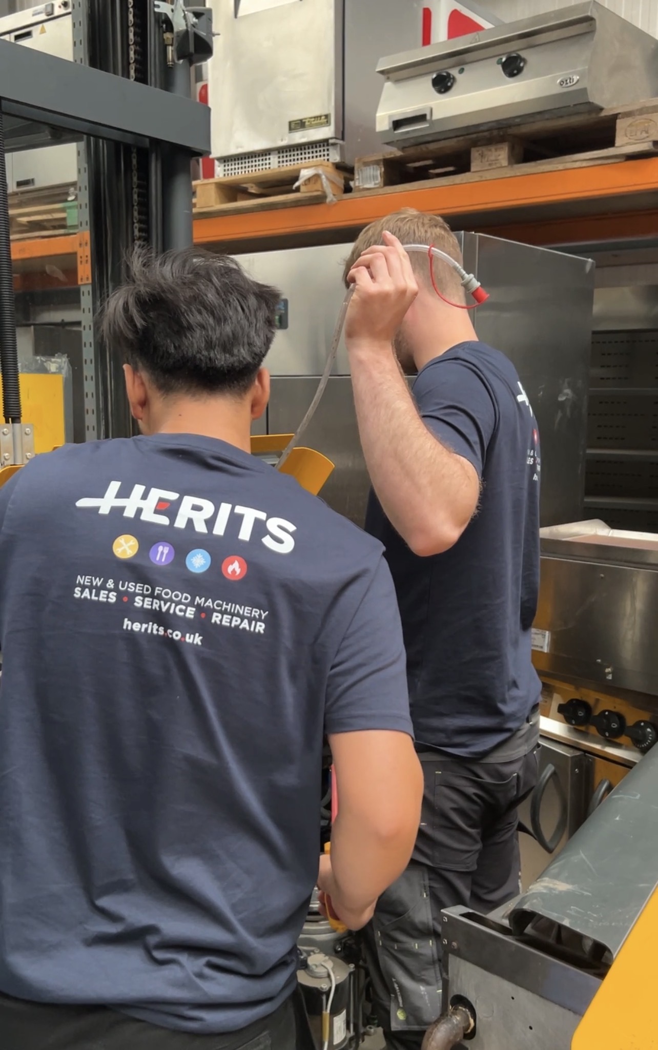 HERITS team working with commercial kitchen equipment